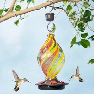 Discover the best gift for her or him with our handcrafted glass hummingbird feeder. Featuring a unique ice cream spiral shape and vibrant colors, this feeder is perfect for all holidays and occasions. Treat yourself or surprise a loved one with this unique and beautiful feeder, designed to attract hummingbirds while adding beauty to your backyard. Alt Text: Hand-Blown Glass Hummingbird Feeder - Unique Ice Cream Spiral Shape - Best Gift for Her or Him
